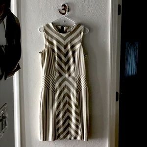 Tailored form fitting dress of imported material